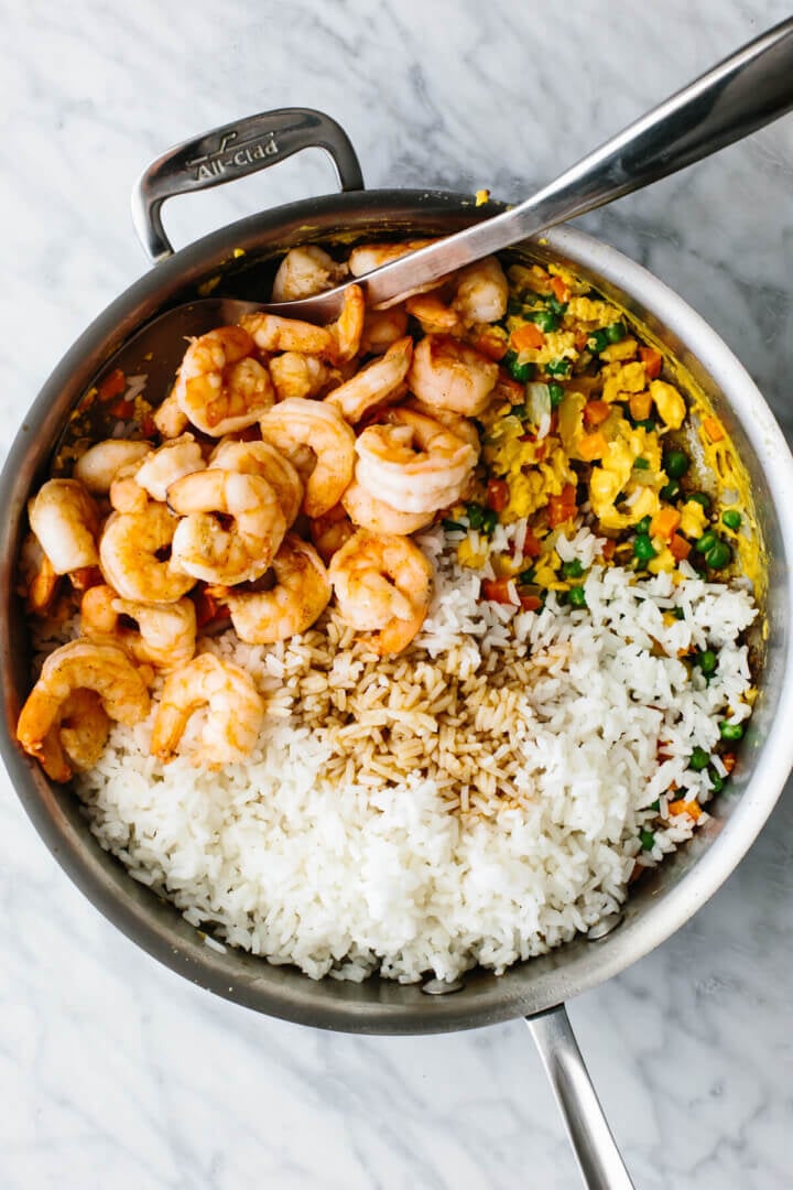 Making shrimp fried rice in a pan