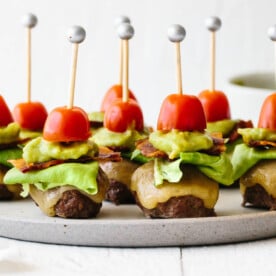 Guacamole bacon burger bites on a plate