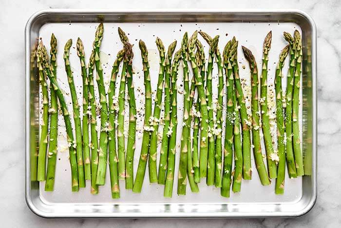 Showing how to roast asparagus.