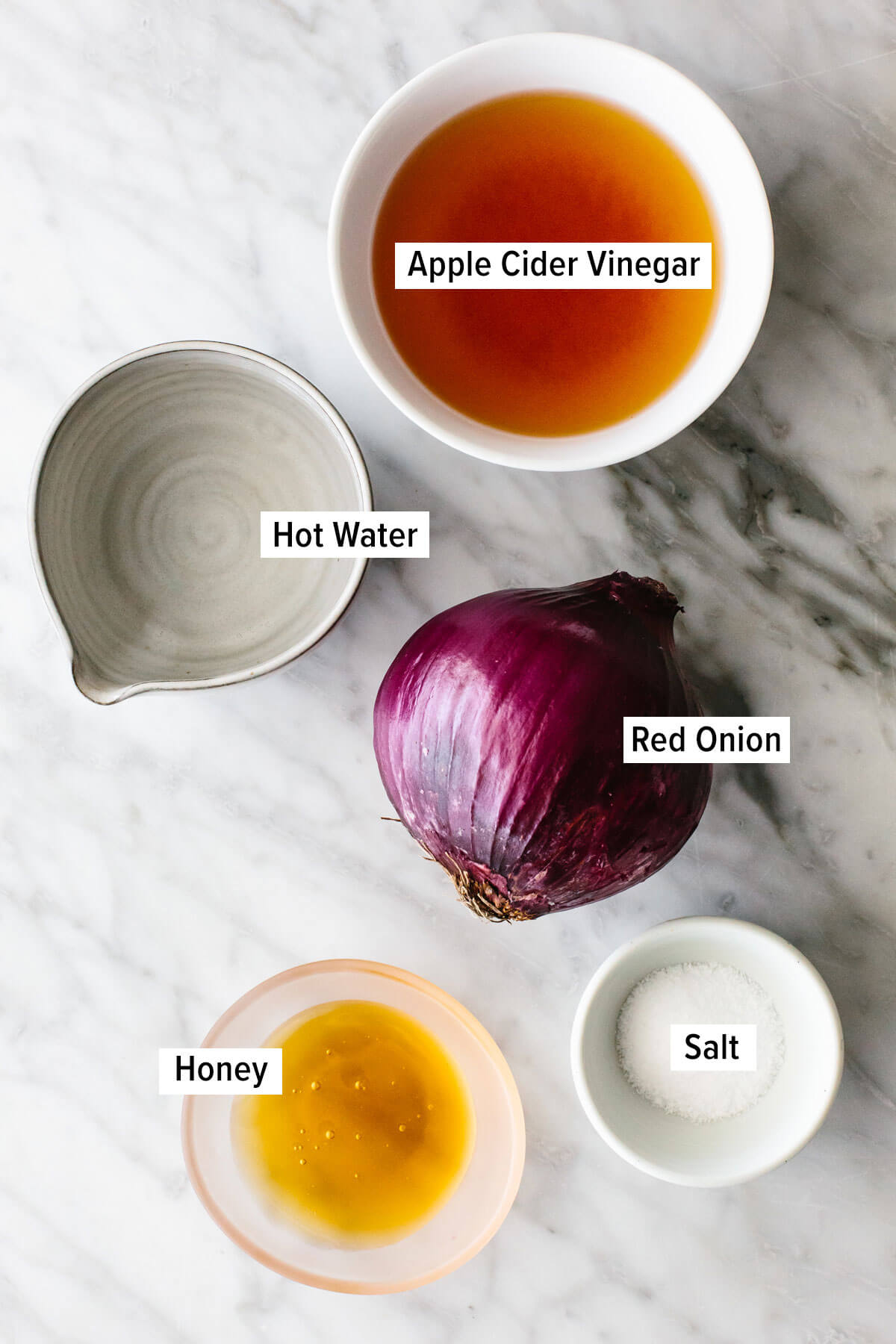 Ingredients for pickled red onions on a table