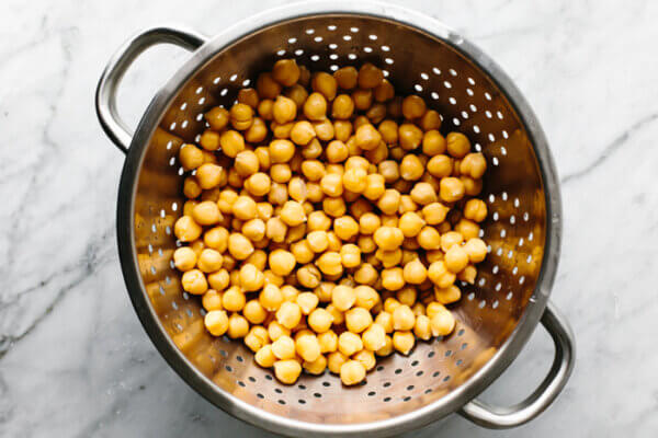 A colander with chickpeas for roasted chickpeas