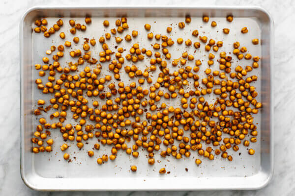 A baking tray wil roasted chickpeas