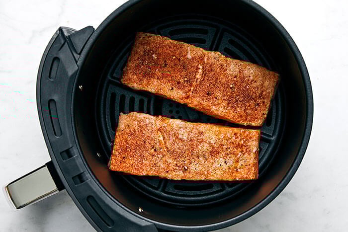 Air frying salmon.