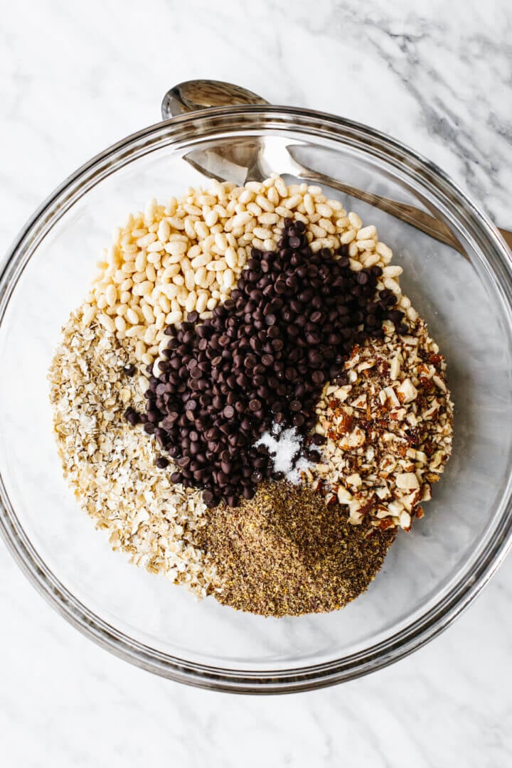 Mixing chocolate chip granola bar ingredients in a bowl