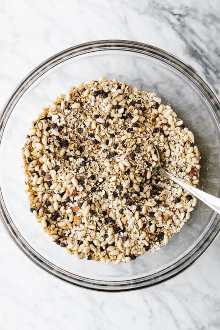 Mixed chocolate chip granola bar ingredients in a bowl