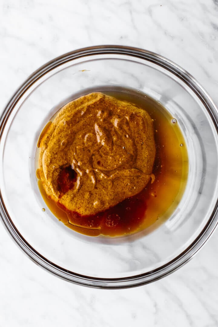 Wet ingredients in a bowl for chocolate chip granola bars