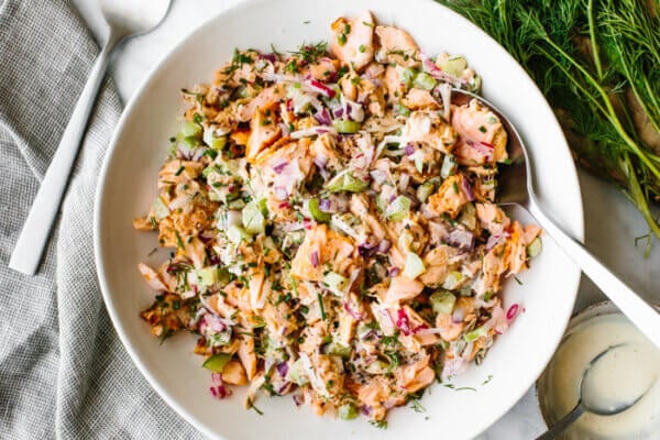 A creamy salmon salad in a bowl with a spoon