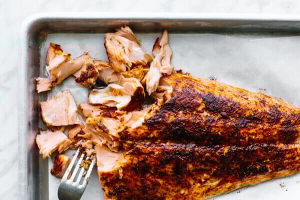 Flaked salmon with a fork for salmon salad