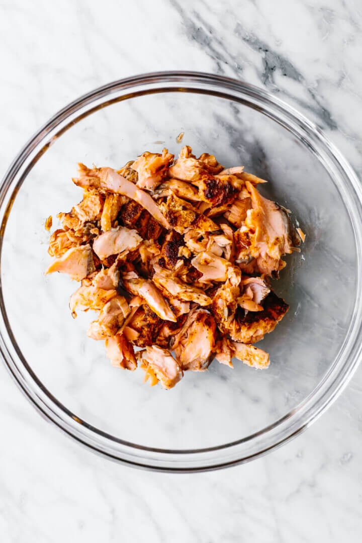 Flaked salmon in a bowl for salmon salad
