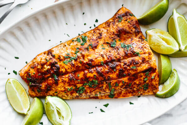 A platter of chili lime trout with limes