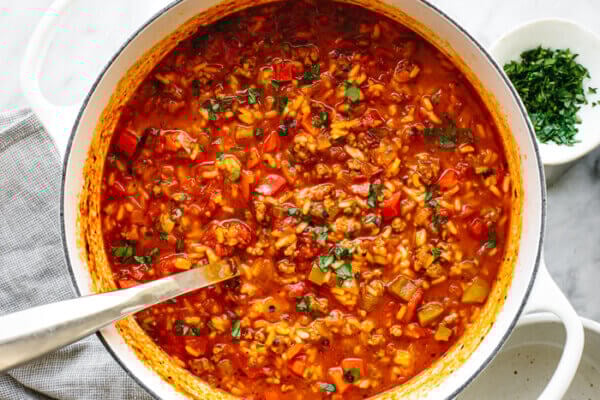 A pot of stuffed pepper soup next to parsley