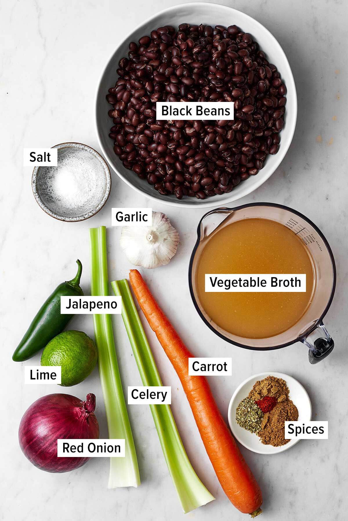 Don't look past this easy black bean soup recipe! It's a delicious vegetarian meal that's filling and layered with savory and spiced flavors. Ingredients for black bean soup on a table