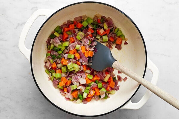 Sauteing vegetables in a pot for black bean soup