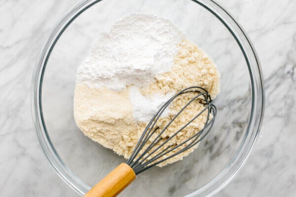 Whisking dry ingredients for cranberry orange muffins
