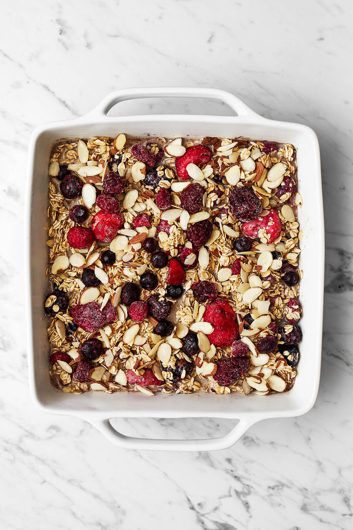 Berry baked oatmeal in a baking dish before baking