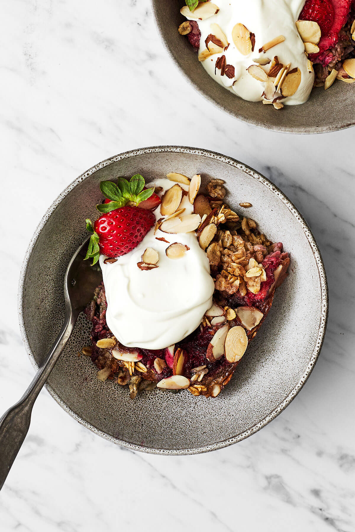 Berry baked oatmeal in a bowl with yogurt