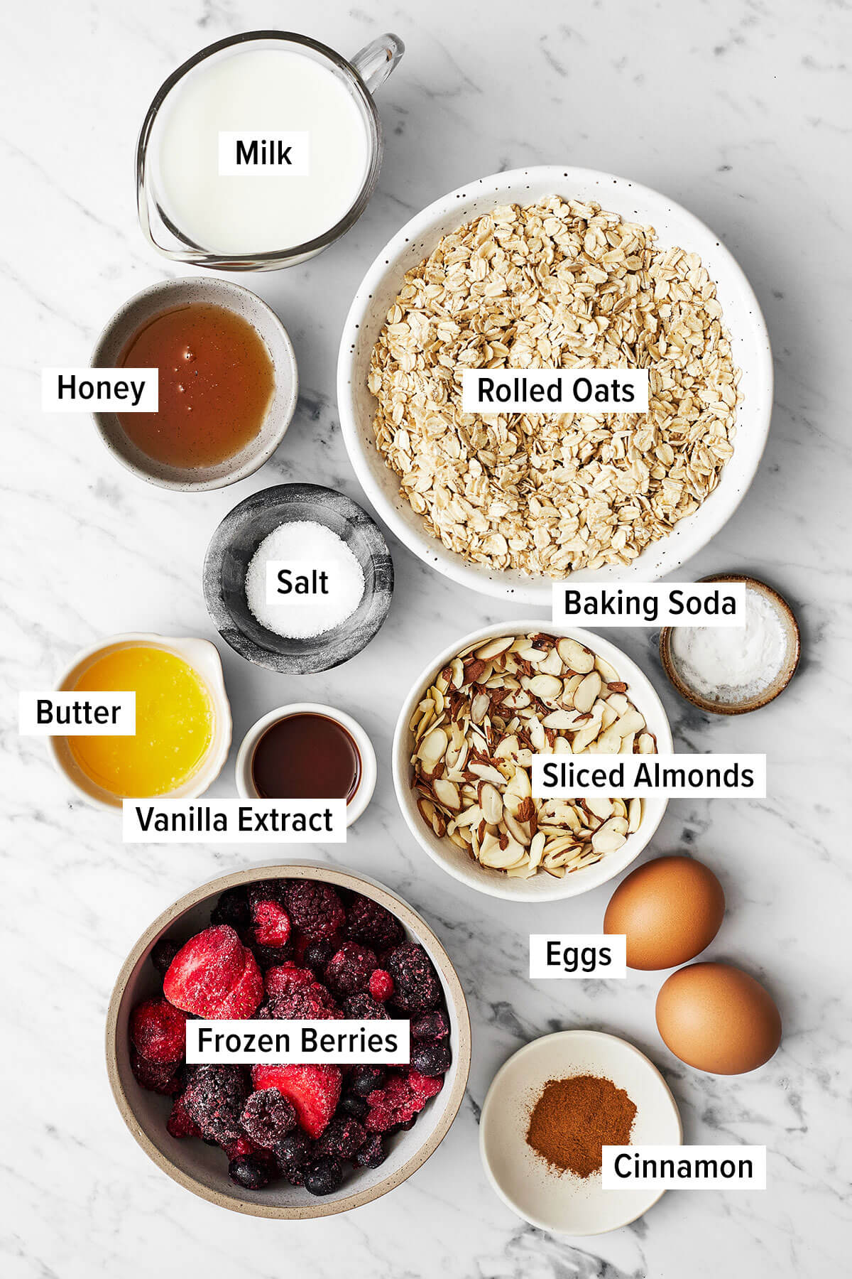 Ingredients for berry baked oatmeal on a table
