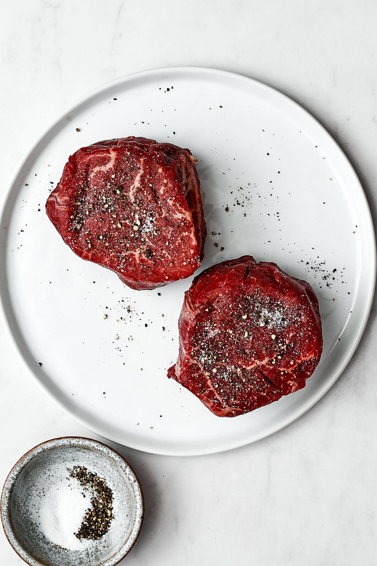 Prepping filet mignon on a plate