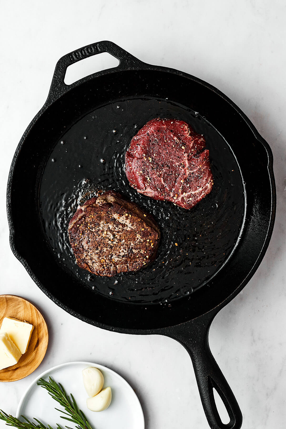 Searing filet mignon in a cast iron skillet