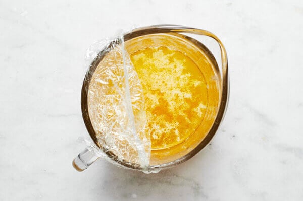 A cup of melted butter for bearnaise sauce
