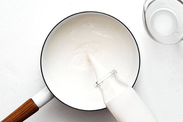 Heating milk in a pot for chocolate pots de creme