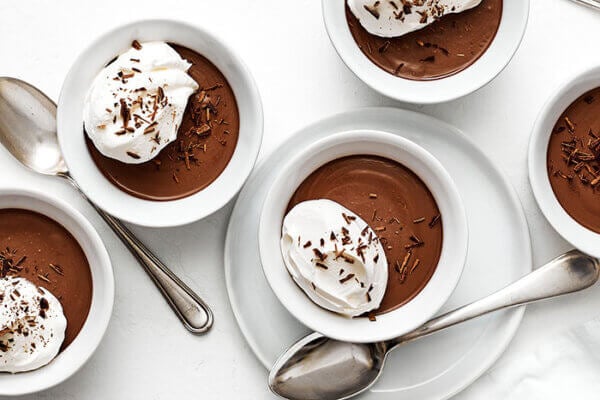 White ramekins of chocolate pots de creme