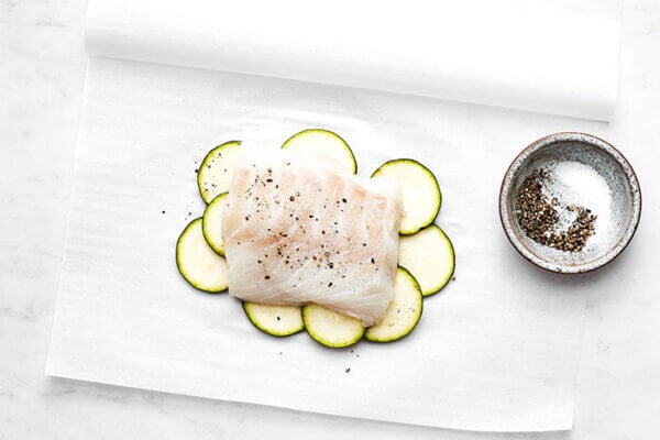 Prepping cod for fish en papillote