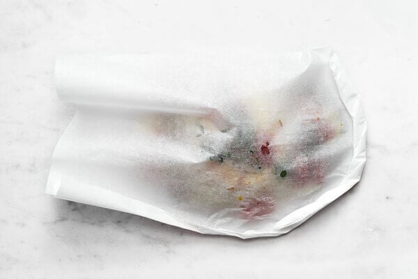 Wrapping fish en papillote into a pouch