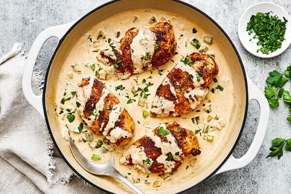 Creamy cajun chicken in a braiser