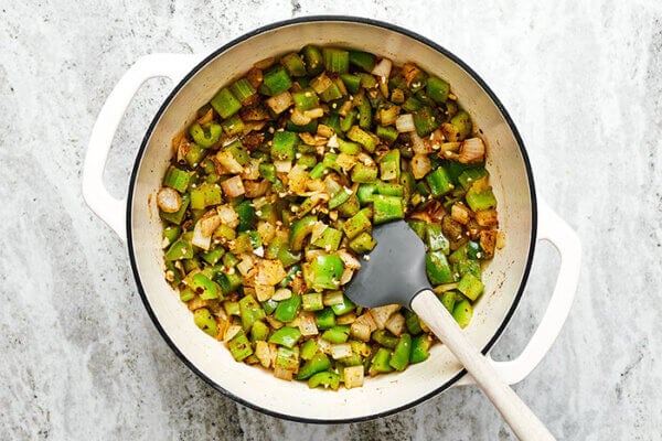 Sauteing veggies in a pot for jambalaya