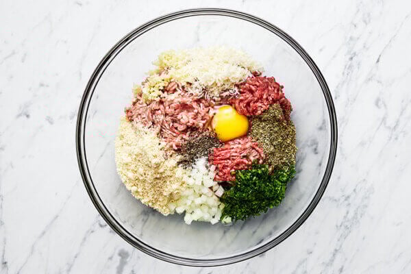A bowl of meatball ingredients