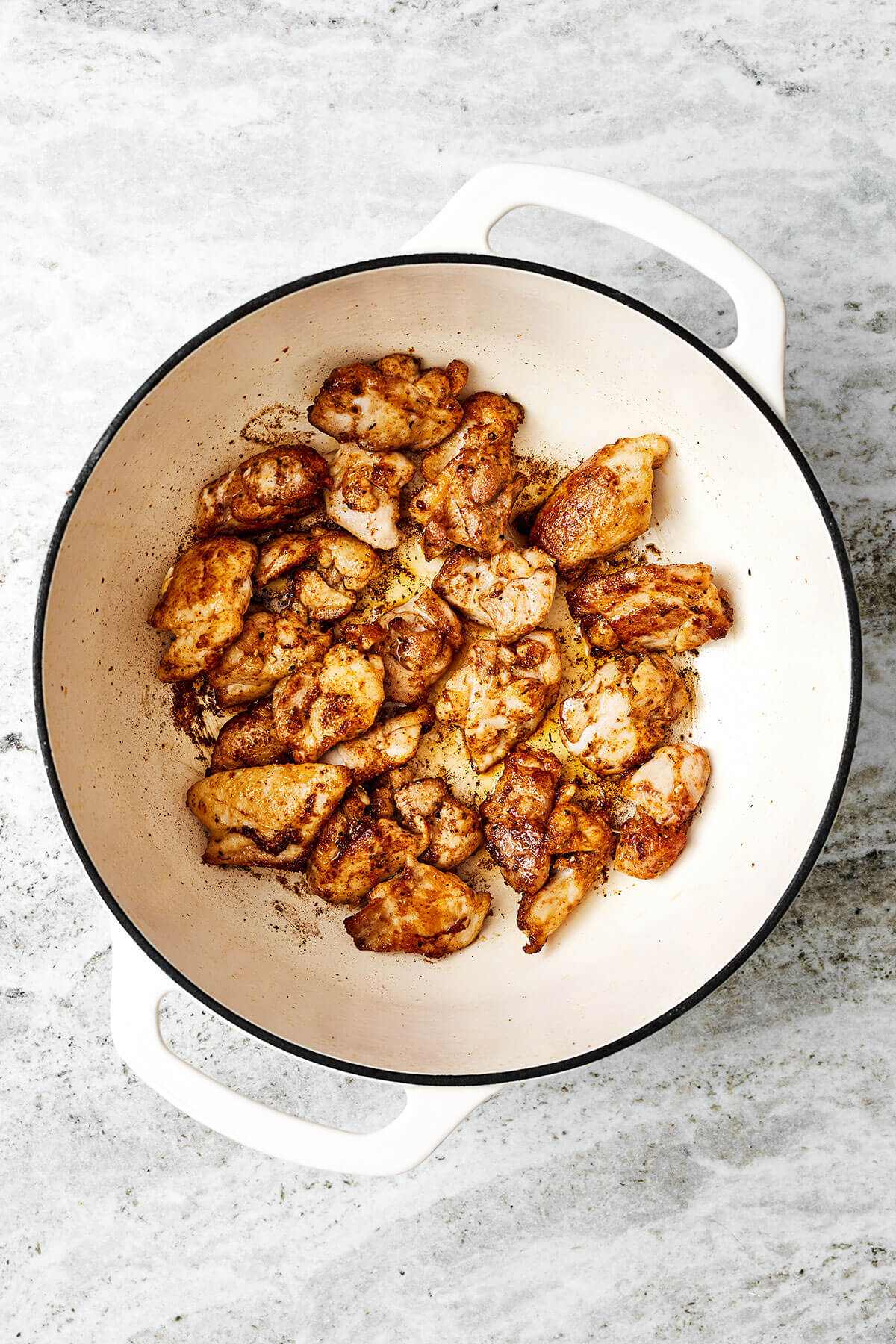 Cooking chicken in a pot for jambalaya