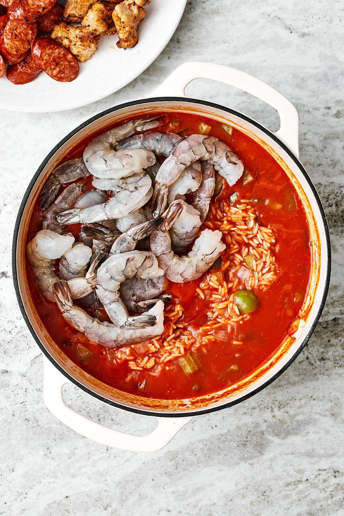 Cooking shrimp in a pot of jambalaya