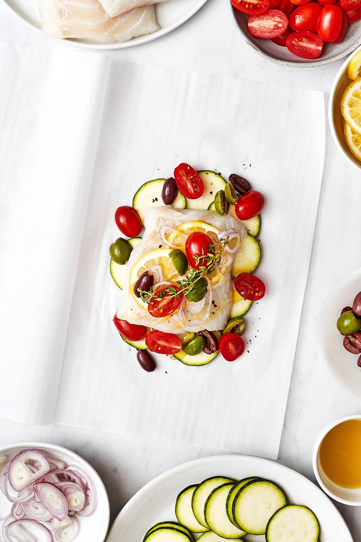 This Mediterranean cod en papillote is the most genius way to quickly achieve a simple, healthy, and super delicious dinner! Layering cod en papillote