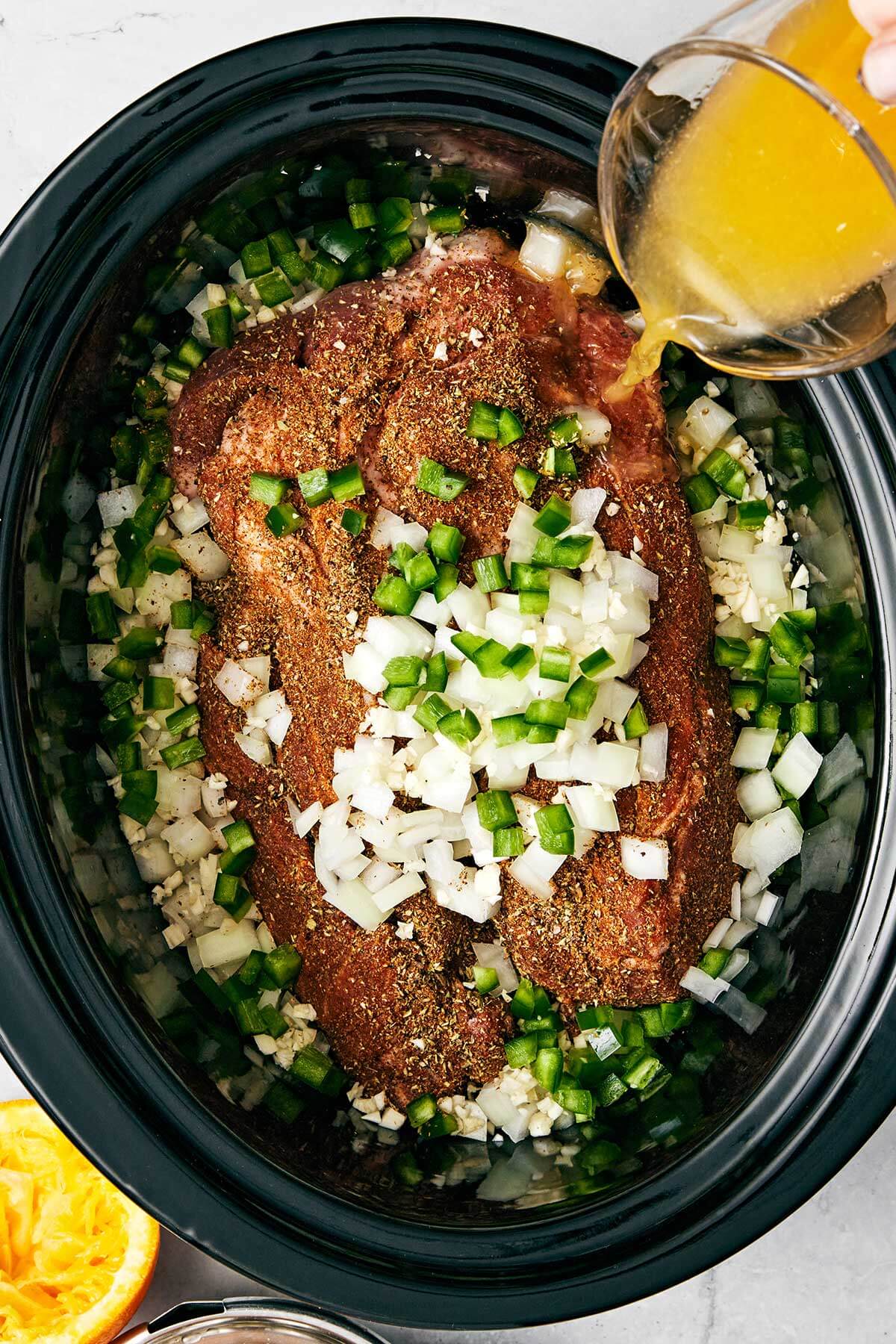The best Mexican carnitas recipe that's juicy, full of flavor, fall-apart tender, and super easy to make in a slower cooker! Making carnitas in a crockpot.