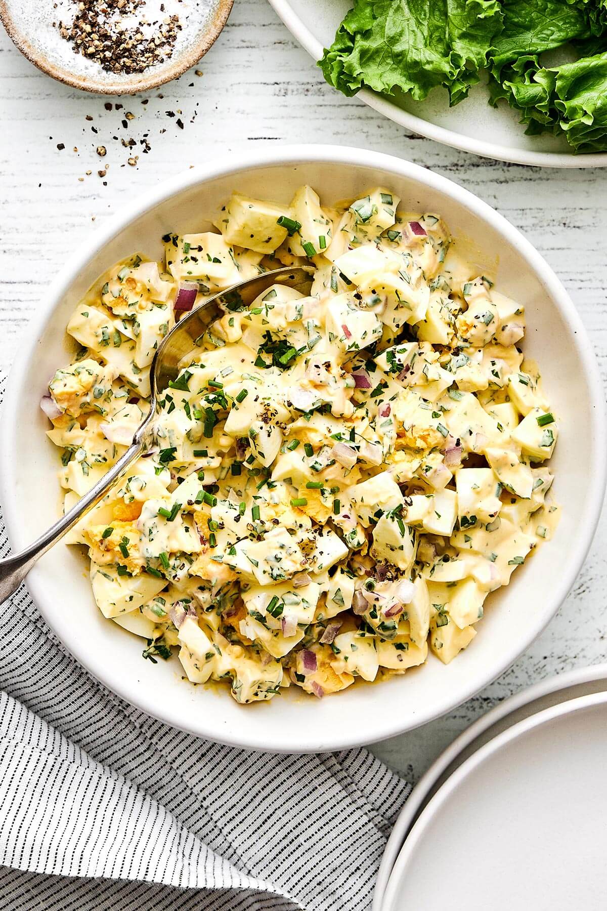 This is the classic deli-style egg salad we all know and love—perfectly creamy, delightfully chunky, and filled with fresh flavors. A bowl of egg salad.