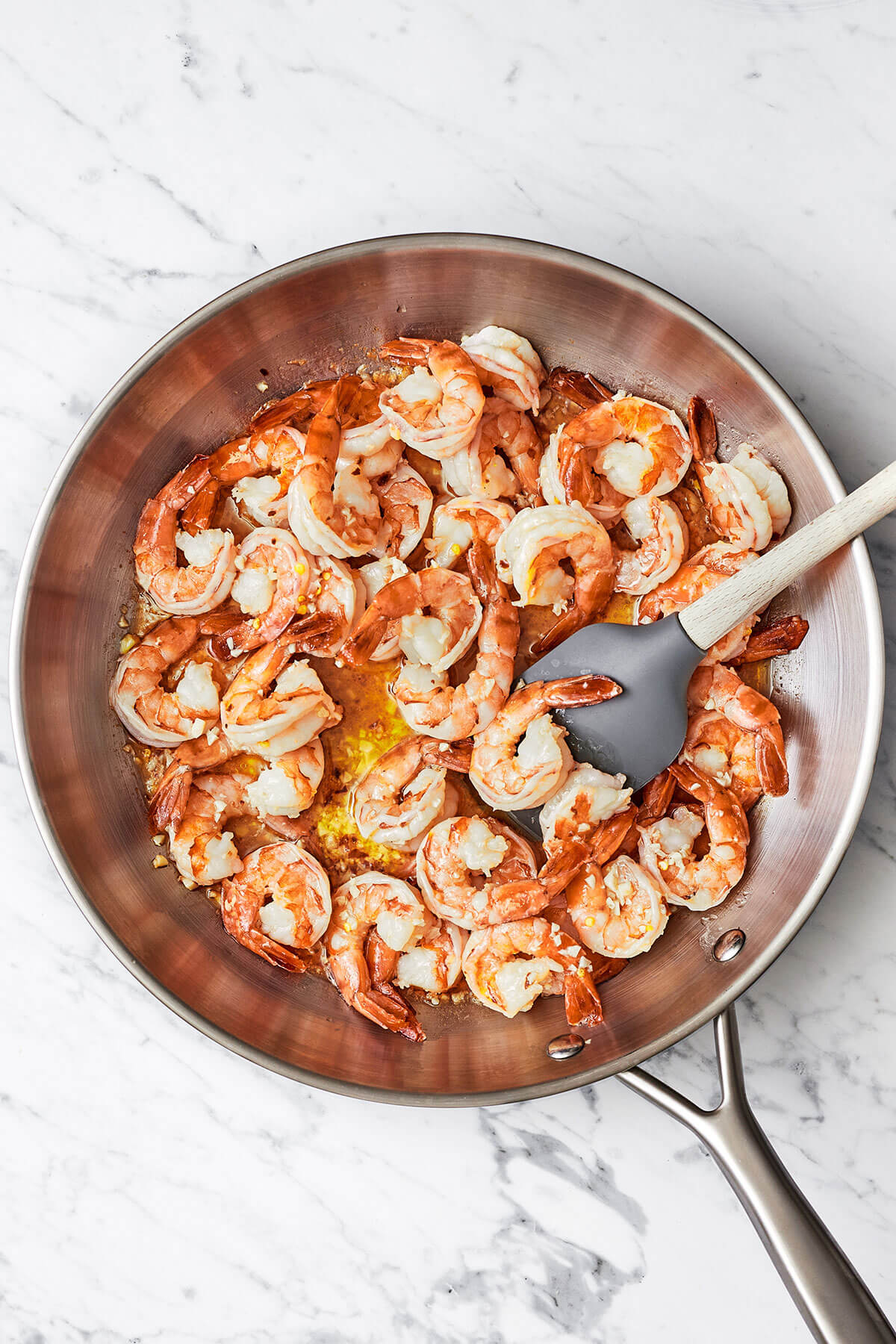 Cooking shrimp scampi in a pan