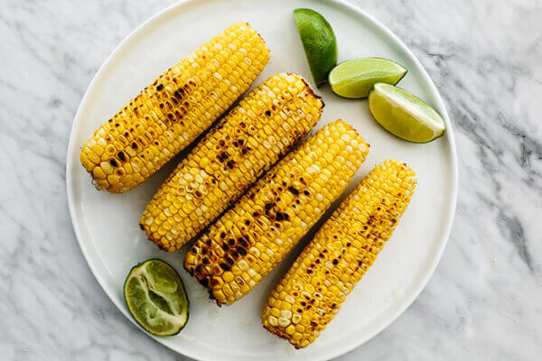 A plate of grilled corn for elote
