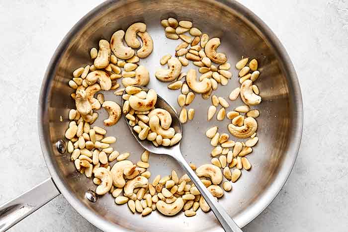 Toasting nuts in a pan.