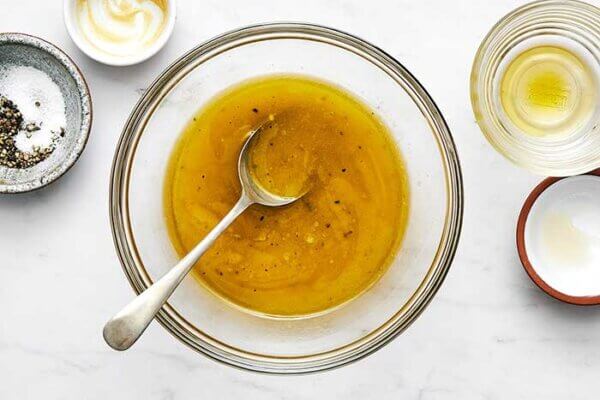 A bowl of Nicoise salad dressing