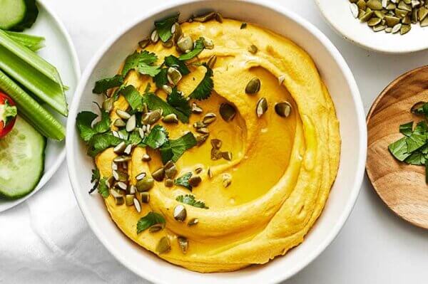 Blended carrot hummus in a bowl