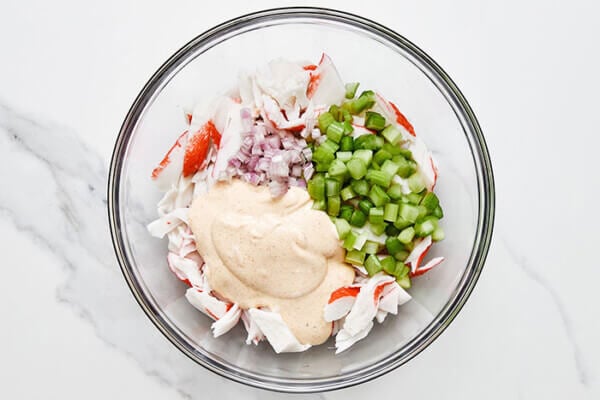 Making crab salad in a bowl