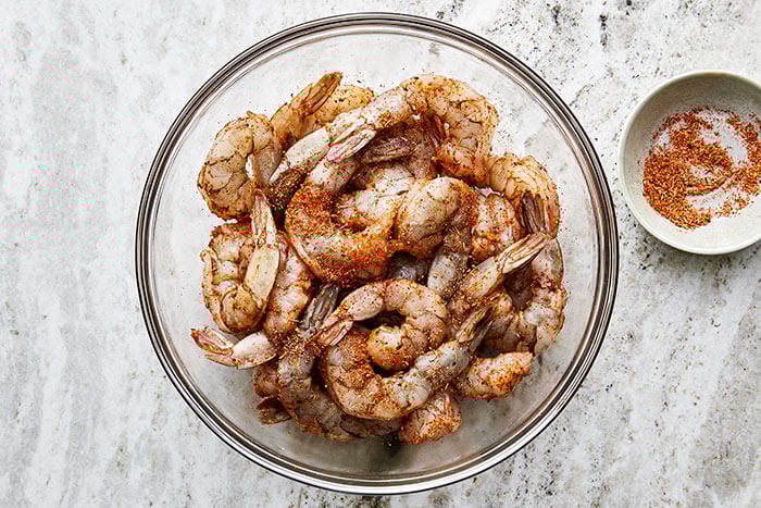 Prepping Cajun shrimp in a bowl