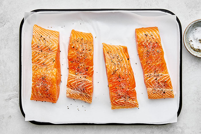 Coating salmon with salt and pepper