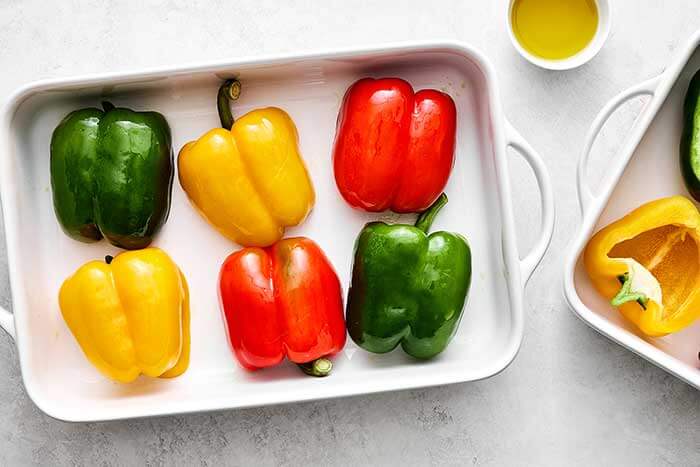 Prepped bell peppers in a dish.