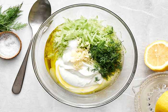 Step two of tzatziki: mix everything together.
