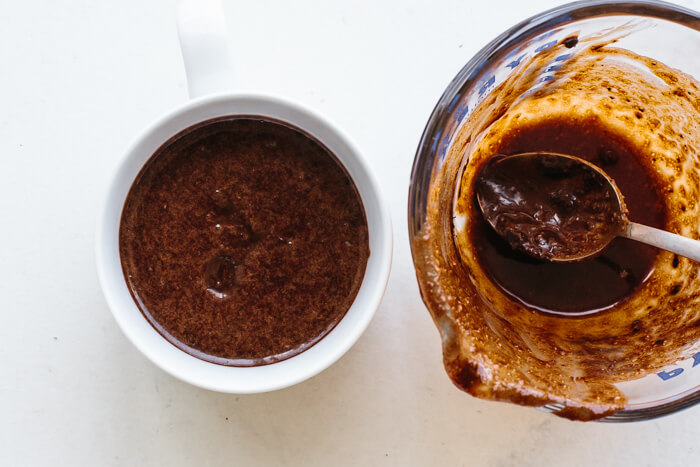 Filling cup with chocolate cake batter