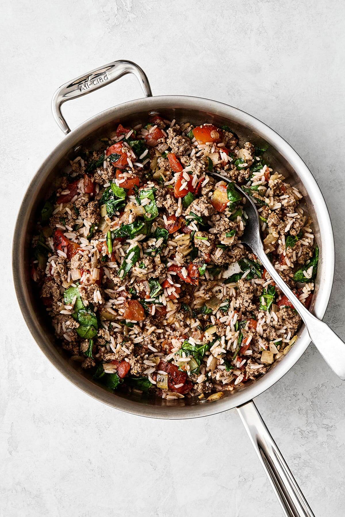 Ground beef filling cooked in a pan.