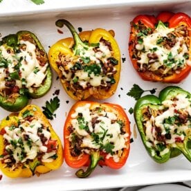 Stuffed peppers in a baking dish.