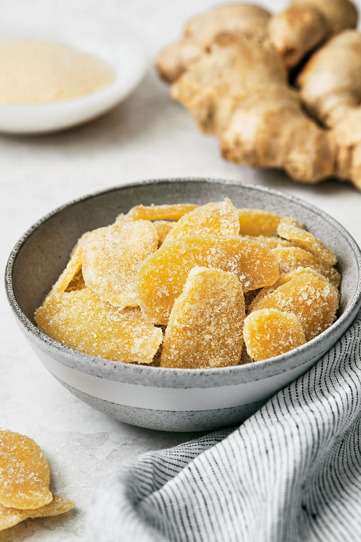 This easy homemade candied ginger is a tasty way to enjoy ginger while reaping all its shining health benefits! Candied ginger in a bowl